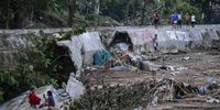 epa12504408 People return to see parts of a river wall damaged due to floods caused by typhoon Kalmaegi at a riverside community in Bacayan, Cebu City, Philippines, 05 November 2025. Typhoon Kalmaegi crossed the Visayas region of the central Philippines on 04 November and caused floods, power outages, and damage to property. According to the National Disaster Risk Reduction and Management Council (NDRRMC), 66 people have died from effects of the typhoon. Data from the Philippine Atmospheric, Geophysical, and Astronomical Services Administration (PAGASA) projects the typhoon to be 190 kilometers west of Palawan province, moving west at 20 kilometers per hour with maximum winds of 130 kilometers per hour.  EPA/JUANITO ESPINOSA