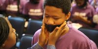 Black tape was placed over protesters mouths to symbolising the silencing effect of gender-based violence at the UCT silent protest against GBV on 2 August 2019. Photo: Sandisiwe Shoba