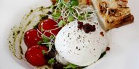 I’m soon picking up a fork to pierce the creamiest burrata. (Photo: Yolanda van der Stoep)<br>