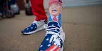 LITITZ, PA - OCTOBER 26:  Andrew Wright, 20, wears Trump themed socks and shoes while joining supporters queuing early morning before President Donald Trump holds a rally on October 26, 2020 in Lititz, Pennsylvania.  With 8 days to go before the election, Trump is holding 3 rallies across Pennsylvania, a crucial battleground state.  In 2016, Trump won Pennsylvania by only 44,000 votes out of more than 6 million cast, the first Republican to carry the Keystone State since 1988. (Photo by Mark Makela/Getty Images)