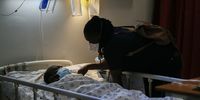 Nurse Florence Kgwarere talks to Amos Mmakou, a patient recovering from cholera  in May 2023 at Jubilee District Hospital in Hammanskraal. (Photo: Felix Dlangamandla)