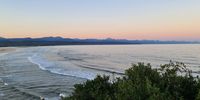 Plettenberg Bay at sundown with Tsitsikama. Mountains in background.