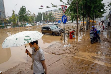 Twenty-one people missing as heavy rains soak southern China, triggering landslides