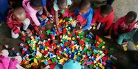 Children play with Lego at a créche at Tholokuhle, one of several local educational initiatives sponsored by Tendele Mining. (Photo: Supplied)