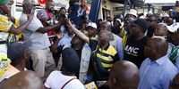 Former president Thabo Mbeki shakes hands with ANC supporters at Jabulani Mall in Soweto. (Photo: Felix Dlangamandla)