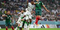 LUSAIL CITY, QATAR - NOVEMBER 30: Mohamed Kanno of Saudi Arabia and Cesar Montes of Mexico compete for the ball during the FIFA World Cup Qatar 2022 Group C match between Saudi Arabia and Mexico at Lusail Stadium on November 30, 2022 in Lusail City, Qatar. (Photo by Justin Setterfield/Getty Images)