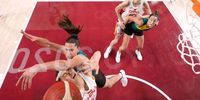 SAITAMA, JAPAN - JULY 30: Siyu Wang #5 of Team China drives to the basket against Marianna Tolo #14 of Team Australia during the first half of a Women's Basketball Preliminary Round Group C game on day seven of the Tokyo 2020 Olympic Games at Saitama Super Arena on July 30, 2021 in Saitama, Japan. (Photo by Charlie Neibergall - Pool/Getty Images)