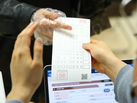 S.Korea scrambles to rework Covid-19 poll plans after early voting lapses