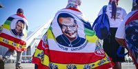 An IFP supporter with a shawl depicting the late party president Mangosuthu Buthelezi at the IFP's national and provincial election manifesto launch at Moses Mabhida Stadium in Durban on 10 March 2024. (Photo: Gallo Images / Darren Stewart)