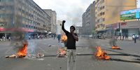 A demonstrator blows a whistle during a protest organized by Venancio Mondlane supporters against the electoral process in Maputo, Mozambique, 27 November 2024. Exiled former presidential candidate Venancio Mondlane has called on the people of Mozambique to abandon their cars in the streets for three days, from 8am until they return from work, to protest against the electoral process after the October 2024 general election.  EPA-EFE/LUISA NHANTUMBO