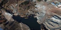 The sprawl of out-of-control chrome operations in North West meets the sprawl of an informal settlement on 31 July 2026