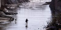 An official, accompanied by dogs, searches for victims and missing people in the Poio ravine in the flood-affected municipality of Catarroja, in Valencia province, Spain, 20 November 2024. Search and cleaning operations continue after floods in Valencia and neighboring provinces, triggered by the DANA (high-altitude isolated depression) weather phenomenon, hit the east of the country on 29 October 2024, causing at least 227 fatalities and 11 people still missing, according to the latest report from the Data Integration Centre (CID).  EPA-EFE/KAI FORSTERLING