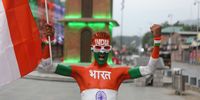 An activist of Akhil Bharatiya Vidyarthi Parishad (ABVP), a student organisation of Rashtriya Swayamsevak Sangh (RSS) waves India's national flag as he celebrates 78th Anniversary of Indian Independence, in Srinagar, the summer capital of Indian Kashmir, 15 August 2024. India declared its independence from British rule on 15 August 1947.  EPA-EFE/FAROOQ KHAN