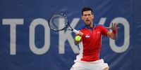 TOKYO, JAPAN - JULY 26: Novak Djokovic of Team Serbia plays a forehand during his Men's Singles Second Round match against Jan-Lennard Struff of Team Germany on day three of the Tokyo 2020 Olympic Games at Ariake Tennis Park on July 26, 2021 in Tokyo, Japan.  (Photo by Clive Brunskill/Getty Images)