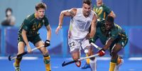 TOKYO, JAPAN - JULY 27: Timothy Drummond (L) and Samkelo Mvimbi of Team South Africa (R) battle for possession with Simon Pierre F Gougnard of Team Belgium during the Men's Preliminary Pool B match between Belgium and South Africa on day four of the Tokyo 2020 Olympic Games at Oi Hockey Stadium on July 27, 2021 in Tokyo, Japan. (Photo by Alexander Hassenstein/Getty Images)