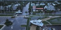 PUNTA GORDA - OCTOBER 10: In this aerial view, boats are washed ashore from when Hurricane Milton passed through the area on October 10, 2024, in Punta Gorda, Florida. The storm made landfall as a Category 3 hurricane in the Siesta Key area of Florida, causing damage and flooding throughout Central Florida. (Photo by Joe Raedle/Getty Images)