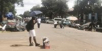 The fresh produce market in the Bulawayo central business district. It is also usually full of people but a lone vendor is standing there with his wares waiting for  a few possible clients to come along. (Photo: Kudzanai Musengi)