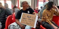 An attendee at the meeting in Community House, Salt River in Cape Town on Saturday, 7 September. (Photo: Lisakanya Ashley Venna)