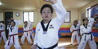 Elderly South Korean women practice TaeKwonDo on February 9, 2006 in Incheon, South Korea. Taekwondo is a modern martial art from Korea that is characterised by its fast, high and spinning kicks. The 20 elderly women who are all over 70 exercise at the gymnasium for their health.  (Photo by Chung Sung-Jun/Getty Images)