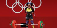 epa09385872 Neisi Dajomes of Ecuador reacts in the women's 76kg category group A during the Weightlifting events of the Tokyo 2020 Olympic Games at the Tokyo International Forum in Tokyo, Japan, 01 August 2021.  EPA-EFE/HEDAYATULLAH AMID