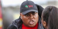 Unathi Ntame, EFF Western Cape provincial chairperson, talks to media at the Borcherds Quarry intersection near Nyanga in Cape Town. (Photo: Shelley Christians)