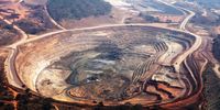 The open pits of the Mutanda copper mine are seen in this aerial view in Katanga province, Democratic Republic of Congo, on Wednesday, Aug. 1, 2012.  Photographer: Simon Dawson/Bloomberg