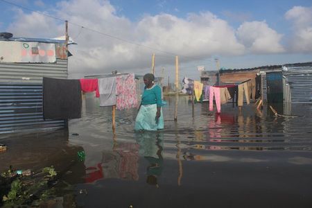 Photo essay: A year in a settlement created by Covid