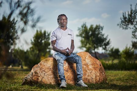 Youth activist Jacques Bona’s tenacity opens the door to a world of learning for his community