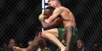  Dricus Du Plessis of South Africa grapples with Israel Adesanya of Nigeria in Perth, Australia. (Photo: Paul Kane / Getty Images)