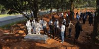 Members of the Central Islamic Trust Burial Society prepare to lower Karima Brown's body into her grave at Westpark Cemetery, Johannesburg, on 4 March 2021. (Photo: Shiraaz Mohamed)