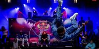epa09490547 A participant shows his skills during the breakdance competition Red Bull BC One Holland Cypher in Rotterdam, The Netherlands, 26 September 2021. Points can be earned in the event that can lead to participation in the 2024 Olympic Games.  EPA-EFE/ROBIN VAN LONKHUIJSEN