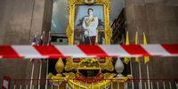 BANGKOK, THAILAND - JANUARY 25: Police tape is put in front of a portrait of King Vajiralongkorn ahead of a pro-democracy demonstraiton lead by Parit "Penguin" Chiwarak on January 25, 2021 in Bangkok, Thailand. Parit and other leaders of the protest movement gathered at the headquarters of the company that is the local producer of AstraZeneca's Covid-19 vaccine to demand transparency, (Photo by Lauren DeCicca/Getty Images)