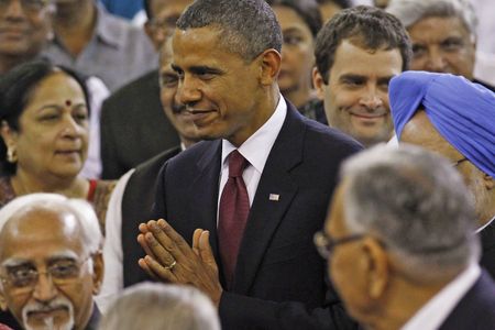 Obama in Asia - with one eye back on Washington