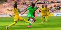 Ohale Osinachi Marvis of Nigeria and a Banyana defender clash during the CAF Women’s Olympic Qualifier, Final Round, 1st Leg match in Abuja, Nigeria. (Photo: Mohammed Chanjo / Gallo Images)