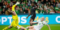 Asisat Oshoala of Nigeria (right) takes a shot on goal past Courtney Brosnan of the Republic of Ireland during the FIFA Women's World Cup 2023 soccer Group B match between Ireland and Nigeria at Brisbane Stadium in Brisbane, Australia, 31  July 2023.  EPA-EFE/DARREN ENGLAND