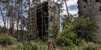 epa10016625 People walk past residential buildings that were damaged during Russian attacks in Irpin, Ukraine, 16 June 2022. The Ukrainian town of Irpin near Kyiv (Kiev), became a battlefield site when the Russian army attacked the Kyiv region in an attempt to reach Ukraine?s capital. Irpin was heavily shelled, causing death and destruction. At the end of March, when the town was taken back by the Ukrainian army, the mayor of Irpin announced that around 300 civilians and 50 Ukrainian servicemen were killed in Irpin during the Russian attacks. On 24 February Russian troops had invaded Ukraine resulting in fighting, deaths and destruction and a humanitarian crisis in the country.  EPA-EFE/ROMAN PILIPEY