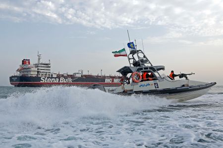 US says it sinks Iranian small boats, shoots down missiles, drones as it opens Strait
