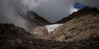 MOUNT KENYA NATIONAL PARK, KENYA - SEPTEMBER 28: The Lewis Glacier, Mount Kenyas largest glacier, lies among rocks on September 28, 2023 in Mount Kenya National Park, Kenya. The second-highest peak in Africa, Mount Kenya, holds some 11 shrinking glaciers said to be rapidly melting due to the burning of fossil fuels, fires, deforestation and land use changes as well as industrial and agricultural developments. Mount Kenya National park and the forest reserve, combined, are inscribed as a UNESCO World Heritage Site. (Photo by Ed Ram/Getty Images)