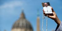 A nun carries a cross and a picture of Pope Francis as she prays in St. Peter's Square following the death of Pope Francis, Vatican City, 21 April 2025. Pope Francis died on 21 April 2025 at the age of 88, according to the Holy See. Born Jorge Mario Bergoglio in Buenos Aires, Argentina, on 17 December 1936, he was appointed leader of the Catholic Church on 13 March 2013, succeeding Pontiff Emeritus Benedict XVI. ( EPA-EFE / ANGELO CARCONI )