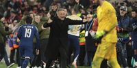 PSG coach Luis Enrique celebrates the victory while goalkeeper of Liverpool Alisson Becker looks down following the penalty shootout of the UEFA Champions League 2024/25 UEFA Champions League 2024/25 Round of 16 Second Leg match between Liverpool FC and Paris Saint-Germain (PSG) at Anfield on March 11, 2025 in Liverpool, England. (Photo by Jean Catuffe/Getty Images)