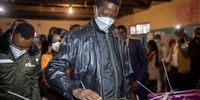 Zambia's incumbent president, Edgar Lungu (centre), casts his vote at a polling station in Lusaka on 12 August 2021. (Photo: Patrick Meinhardt / AFP)