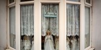 A display of dolls stand in the window of home in central Blackpool on November 04, 2025 in Blackpool, England. Seven neighbourhoods in Blackpool rank amongst the top 10 most deprived in England according to the English Indices of Deprivation report released last week.  (Photo by Christopher Furlong/Getty Images)