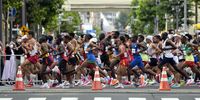 epa09405026 Runners compete in the Men's Marathon during the Athletics events of the Tokyo 2020 Olympic Games at the Odori Park in Sapporo, Japan, 08 August 2021.  EPA-EFE/KIMIMASA MAYAMA