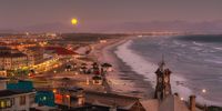 Empty Muizenberg beach and restaurants on a beautiful, summer full moon evening.  Natalie Goldsmith<br>www.natgoldza.co.za
