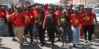 EFF supporters outside East London Magistrates’ Court on 1 October after party leader Julius Malema  was found guility of firearms offences. (Photo: Monde Ndalaza / Stringer)