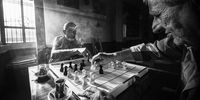 "Fight". Two old friends, playing chess in a cafe. © Roni Süslü, Turkey, Shortlist, Open, Lifestyle, 2022 Sony World Photography Awards