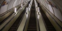 A Ukrainian soldier climbs an escalator at a deserted Kyiv metro station in Kyiv, Ukraine, on Wednesday, March 2, 2022. Russia said it would press forward with its invasion of Ukraine until its goals are met, as troops were seen moving in a large convoy toward the capital, Kyiv. Photographer: Erin Trieb/Bloomberg via Getty Images