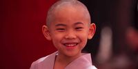 A young monk reacts after his getting his hair shaved off during the 'Children becoming Buddhist monks' ceremony at the Jogyesa temple in Seoul, South Korea, 09 May 2023. The children will stay at the temple to learn about Buddhism for 21 days. South Korean Buddhists prepare to celebrate Buddha's upcoming birthday on 27 May.  EPA-EFE/JEON HEON-KYUN