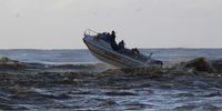 A skiboat crew heads out to sea from the mouth of the Lake St Lucia estuary during the recent Rosebowl deep sea fishing tournament. Picture Tony Carnie
