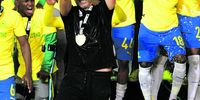 Mamelodi Sundowns coach Miguel Cardoso celebrates with players after winning the league. Now they face a bigger challenge against the world's best. (Photo: Lefty Shivambu/Gallo Images)